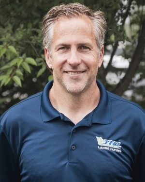 Drew Reish, General Manager of JHL Deck Builders, in a navy JHL polo