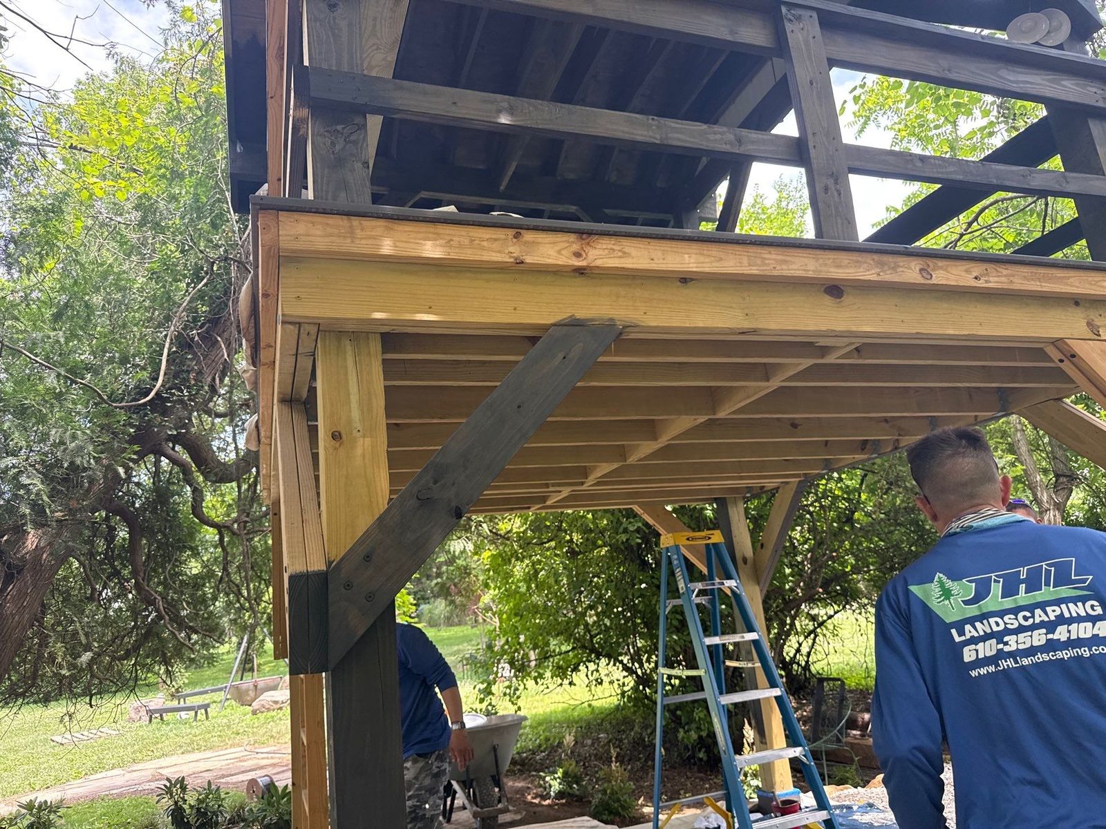 JHL crew member framing an elevated second-story covered deck near Newtown Square, PA