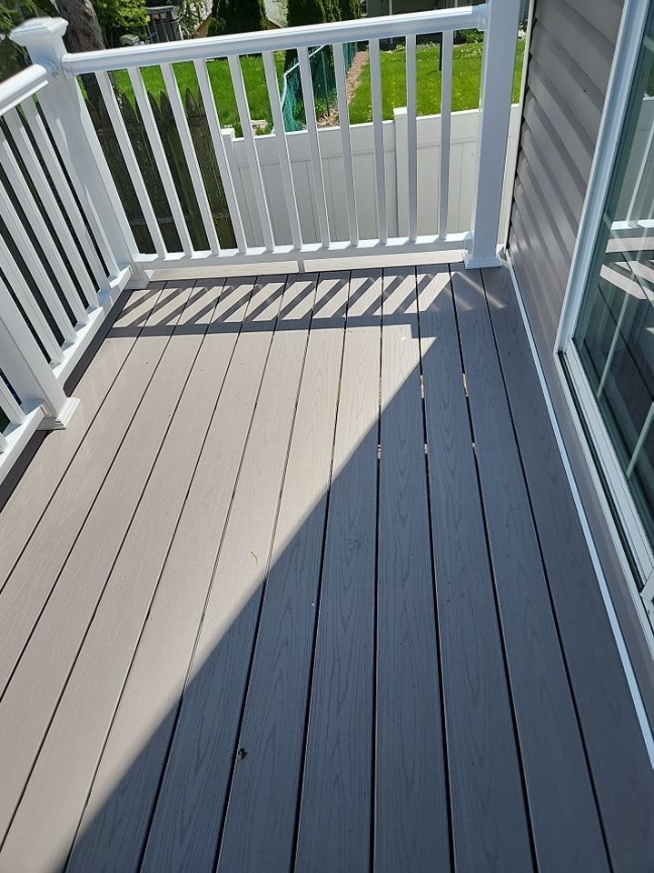 Two-tone composite deck with white vinyl railing at a home near Newtown Square, PA
